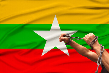 male hands break the iron chain, a symbol of tyranny, protest against the background of the...
