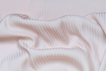 Delicate light pink fabric, pleasant to the touch.