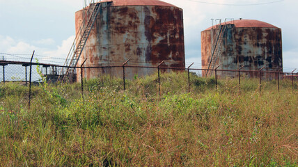 Old rusty industrial storage tanks