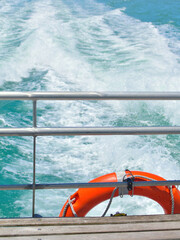 swim ring with foamy water trace behind boat