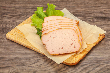 Boiled pork sausage over board