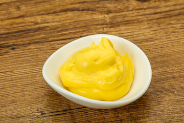 Natural cheese sauce in the bowl