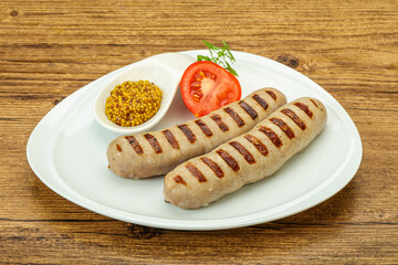 Grilled natural pork sausages with sauce