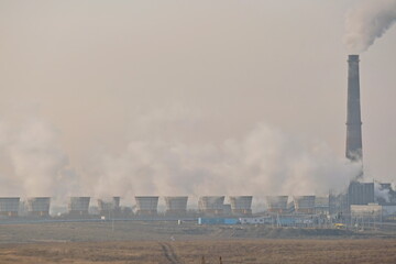 Almaty, Kazakhstan - 02.04.2021 : Territory and building of the heating plant with smoking pipes