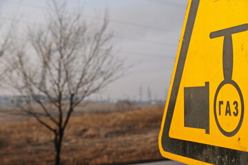 Warning sign with the inscription in Russian: gas