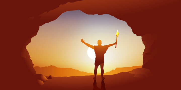 Concept de l&rsquo;origine de l&rsquo;humanit&eacute; et de l&rsquo;invention du feu, avec un homme pr&eacute;historique qui brandit une torche allum&eacute;e &agrave; l&rsquo;entr&eacute;e de sa grotte, en regardant le soleil.