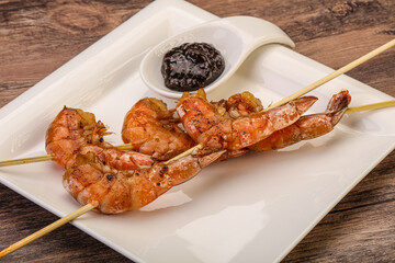 Grilled prawn skewer with pepper sauce