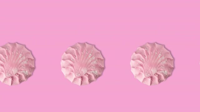 seamless looping animation with many pink marshmallows on a pink background