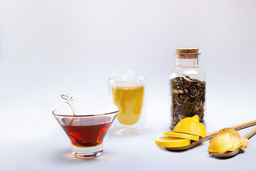 Ginger tea with lemon and honey on a light background. Ingredients for tea on a light background. Products to strengthen the immune system.