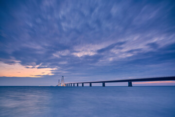 Fototapeta na wymiar a bridge at night with beautiful blue sunset