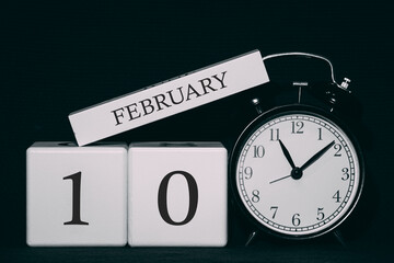 Important date and event on a black and white calendar. Cube date and month, day 10 February. Winter season.