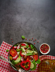 greek salad on grey stone surface