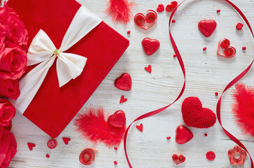 St. Valentine's day decorations on white wooden surface