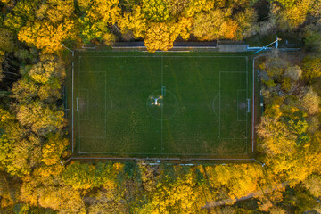 Aerial view of a drone flying over a football field.