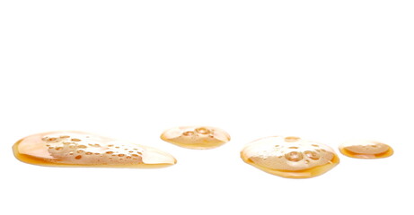 Beer puddle with froth isolated on white background