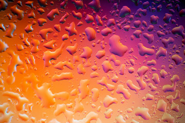 multicolored water drops on glass, gradient