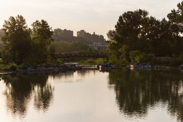 Fototapeta na wymiar view of Bow river floing inside Calgary, Alberta, Canada