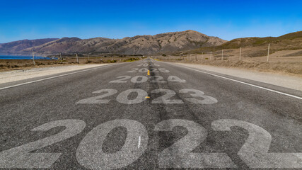 2022-2027 written on highway road to the mountain