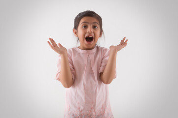 portrait of a young girl looking in excitement	