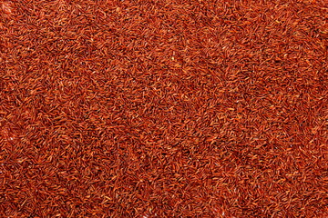 raw red rice background. uncooked brown wild rice, top view