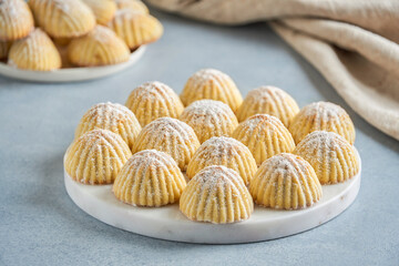 Arabic sweets. Traditional eid semolina maamoul or mamoul cookies with dates , walnuts and pistachio nuts . Close up