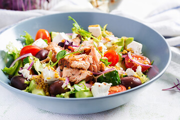 Ketogenic lunch. Greek salad with grilled salmon. Healthy dinner. Keto, paleo diet.