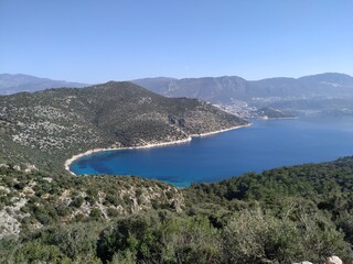 Obraz premium Firnaz cove is located in the Kalkan district of Antalya Province. The has a blue sea and magnificent nature.