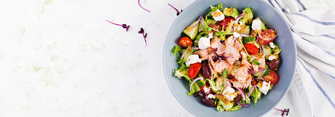 Ketogenic lunch. Greek salad with grilled salmon. Healthy dinner. Keto, paleo diet. Top view, banner, copy space