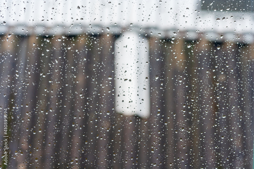 Poster rain drops on window glasses surface background. natural pattern of raindrops pattern