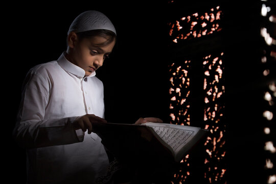 Muslim Boy Reading  Quran	
