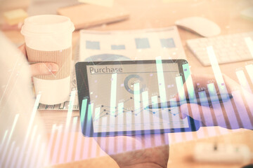 Double exposure of man's hands holding and using a phone and financial chart drawing. Market analysis concept.