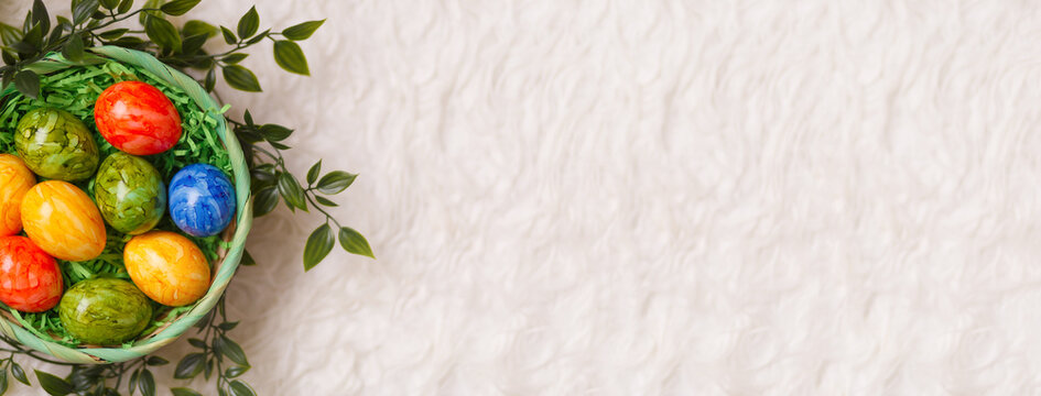 Banner for easter card. Flat lay composition with Easter eggs on white background.