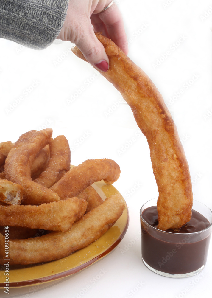 Sticker fried sugar bars with hot chocolate as typical spanish snack