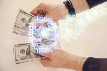 Multi exposure of technology drawing hologram and us dollars bills and man hands. Data concept