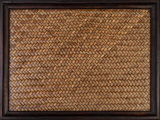 A bamboo veneer weave with wooden frame for background.