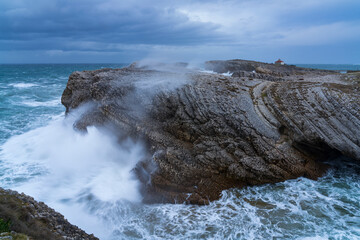 Swell and storm in the Hermitage of the Virgen del Mar San Roman de la Llanilla.Municipality of Santander. Virgen del Mar Island in the Cantabrian Sea. Autonomous Community of Cantabria. Spain. Europe