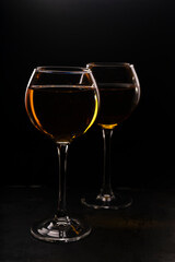 amber or orange wine made from white grapes. in a tall wine glass. Georgian national wine according to old technology. in a low key