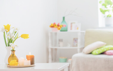 white home interior with spring flowers and decorations