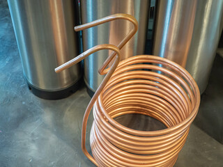 A copper immersion heat exchanger for use in the craft beer process. Selective focus. Home brewing...