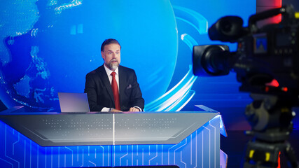 Live News Studio with Professional Male Newscaster Reporting on the Events of the Day. TV...