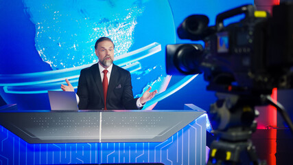 Live News Studio with Professional Male Newscaster Reporting on the Events of the Day. TV...