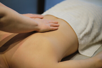 Close-up of man enjoying in relaxing back massage, four hands massage