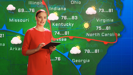 Live Weather News Studio with Professional Female On-Camera Meteorologist Standing Beside Screen...