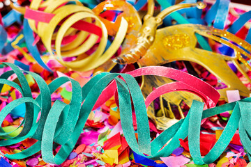 Fototapeta na wymiar Close-up multicolored streamers and multicolored confetti