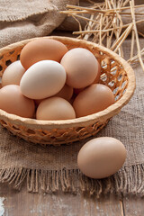 Organic eggs in the basket on the cloth