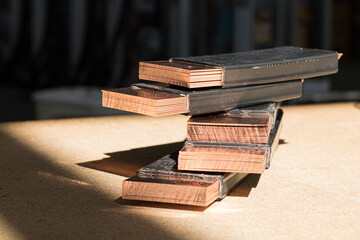 Closeup shot of busbars stacked on each other
