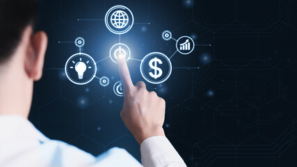 Businessman touch technology icons on the virtual screen to create a modern business strategy. Technology concepts and data transfer, and cyber security concepts.
