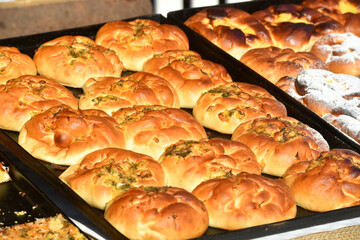 Moldovan pies placed in the baking tray, natural pies. Traditional Romanian.