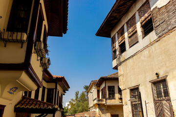 Fototapeta na wymiar Typical houses of Old Town, Antalya, Turkey. Restorated house vs. ruins of abondened old house.