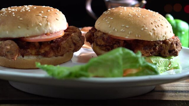 Truck shot of two zinger burgers.